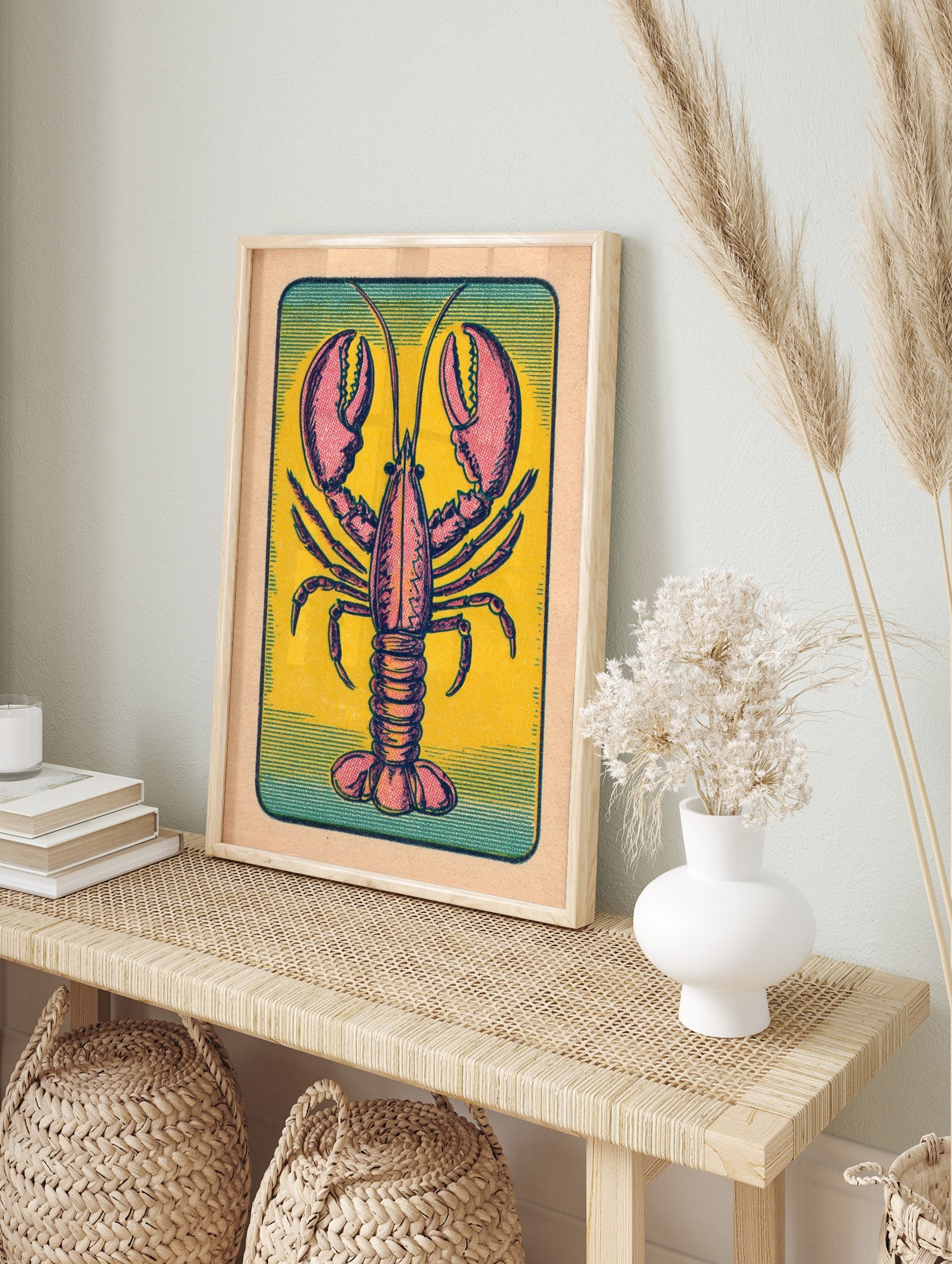 Vintage lobster illustration print with pink and red animal on yellow background and teal, in an alternate framed mockup