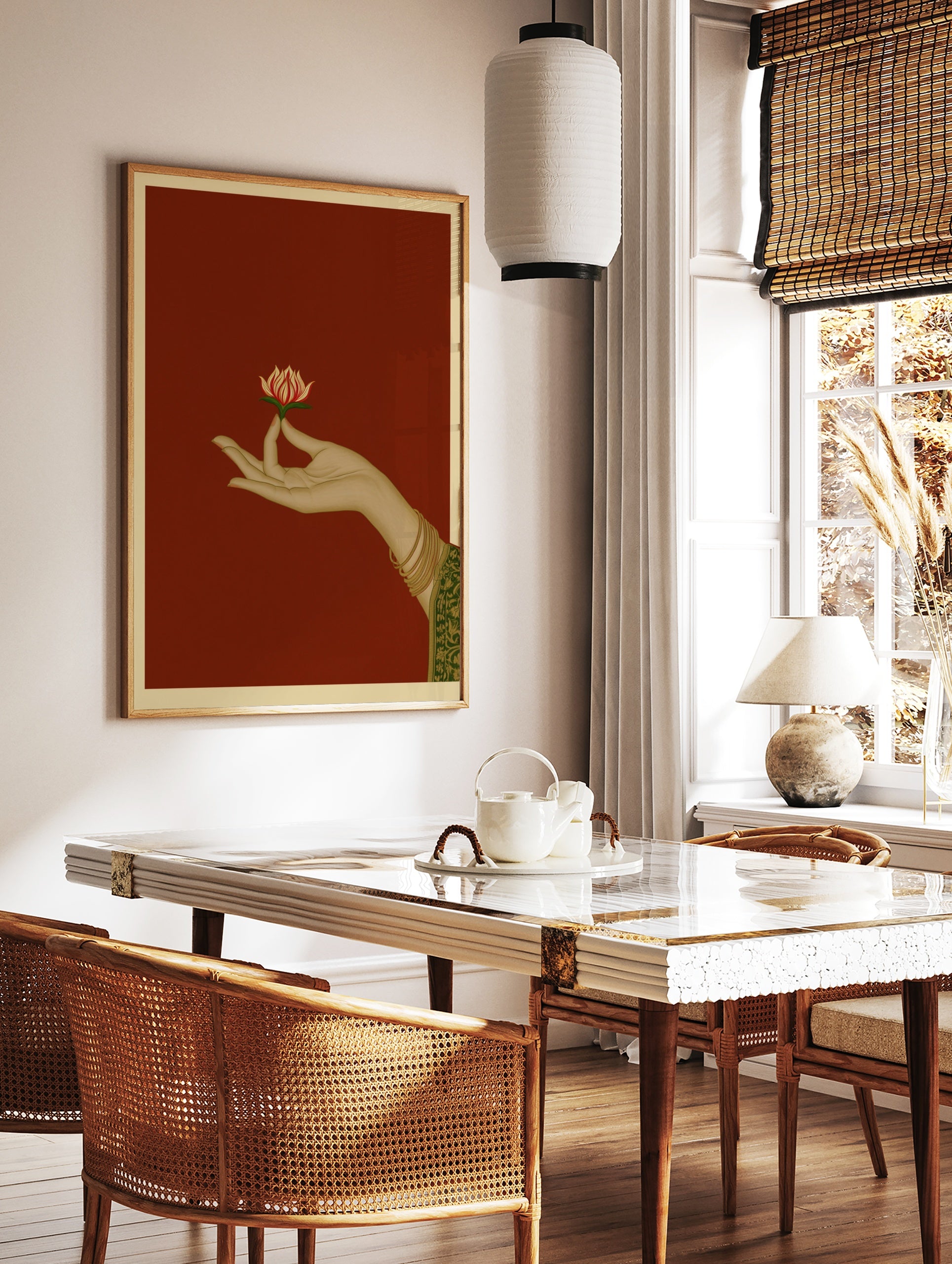 Illustration of a hand holding a lotus flower on a red background, traditional Indian art style, in a styled room mockup