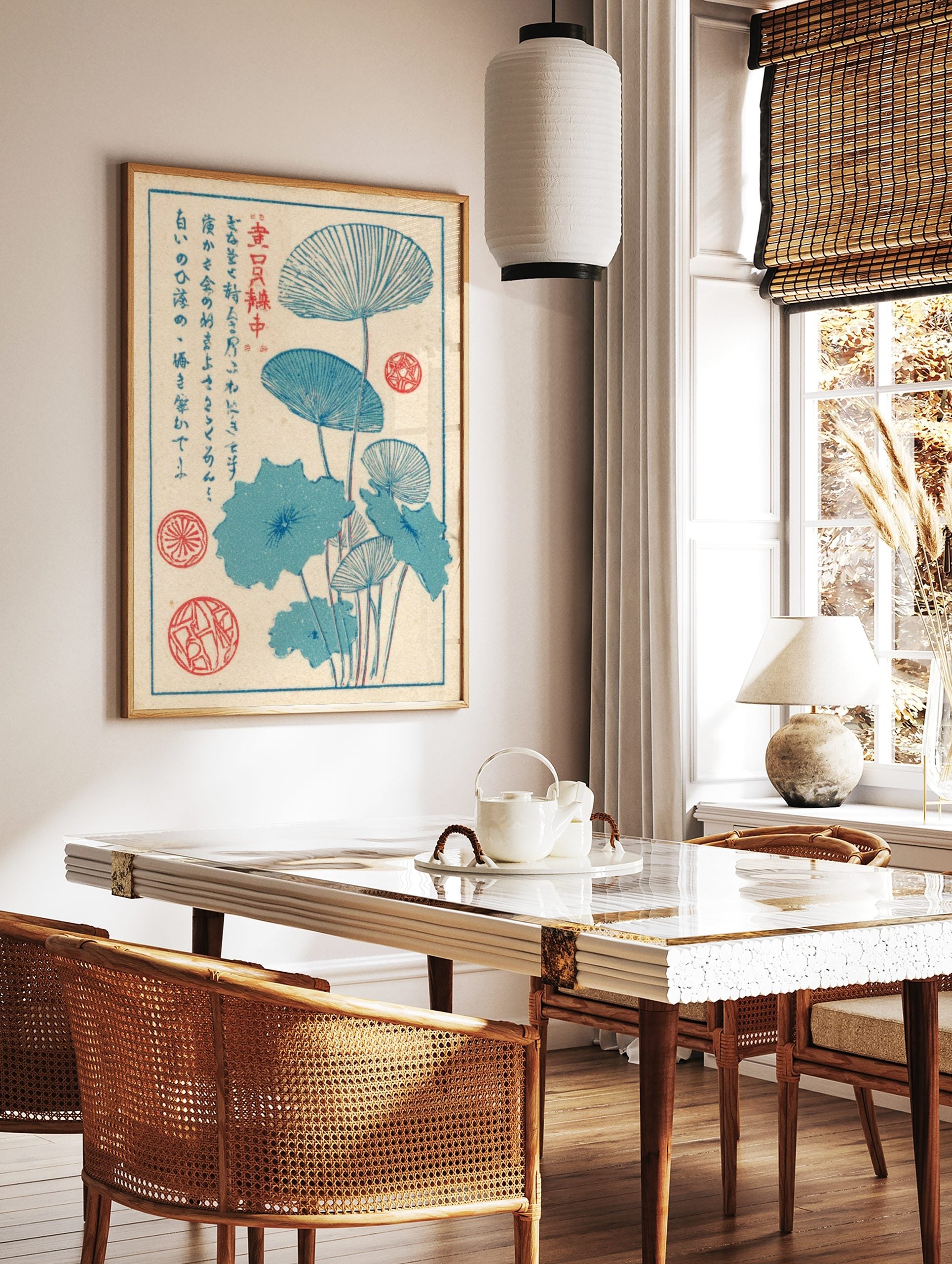 Japanese woodblock style art print of blue lotus leaves and stems with red seals and vertical text, in a styled room mockup