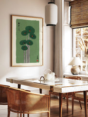 Japanese-inspired lotus leaf botanical print with dark green leaves, orange centres, white stems, in a styled room mockup