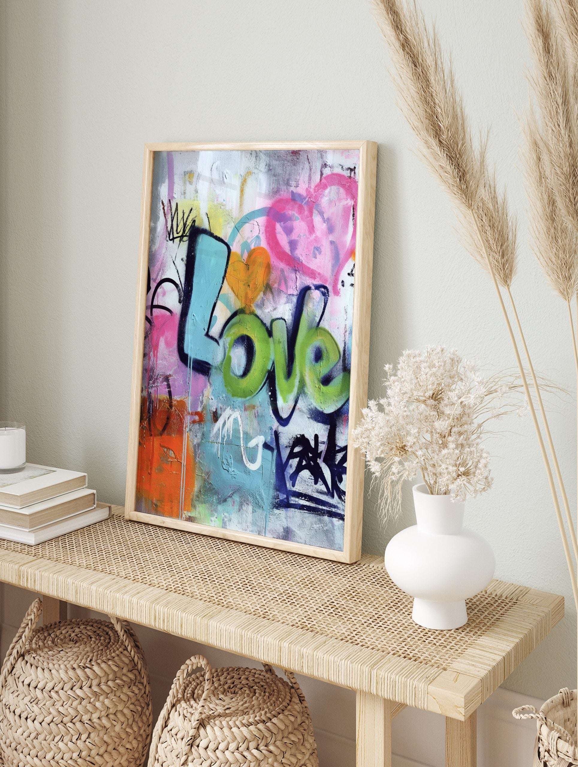 Colourful graffiti wall art print with 'Love' in blue and green bubble letters, an orange, in an alternate framed mockup