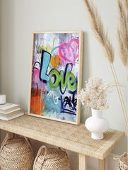 Colourful graffiti wall art print with 'Love' in blue and green bubble letters, an orange, in an alternate framed mockup