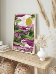 Illustrative magenta and green forest landscape with pine trees and a large yellow sun, with, in an alternate framed mockup