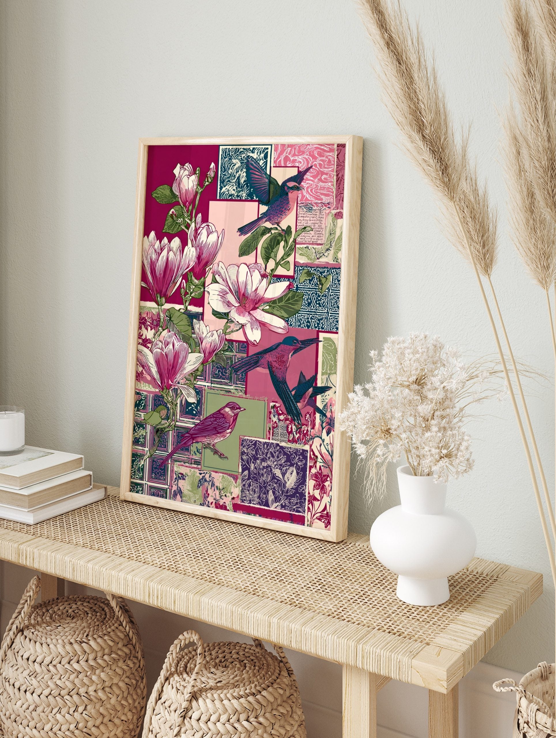 Illustrative collage print with pink magnolia flowers, various colourful birds, and patterned, in an alternate framed mockup
