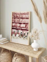 Watercolour illustration of five mallard ducks in a row in front of reddish-brown theatre, in an alternate framed mockup