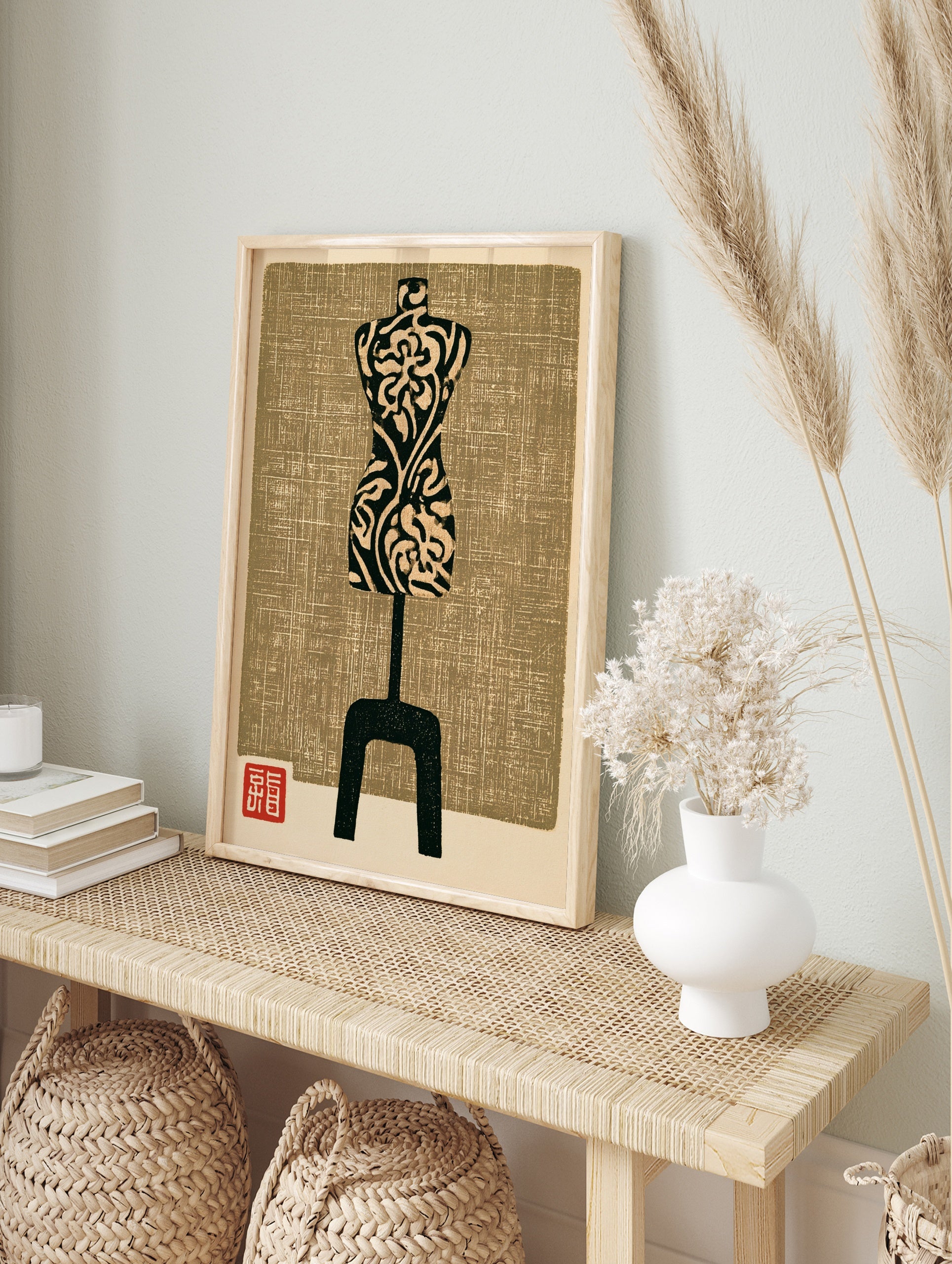 Mannequin wall art print with floral pattern and textured tan background in a woodblock style, in an alternate framed mockup