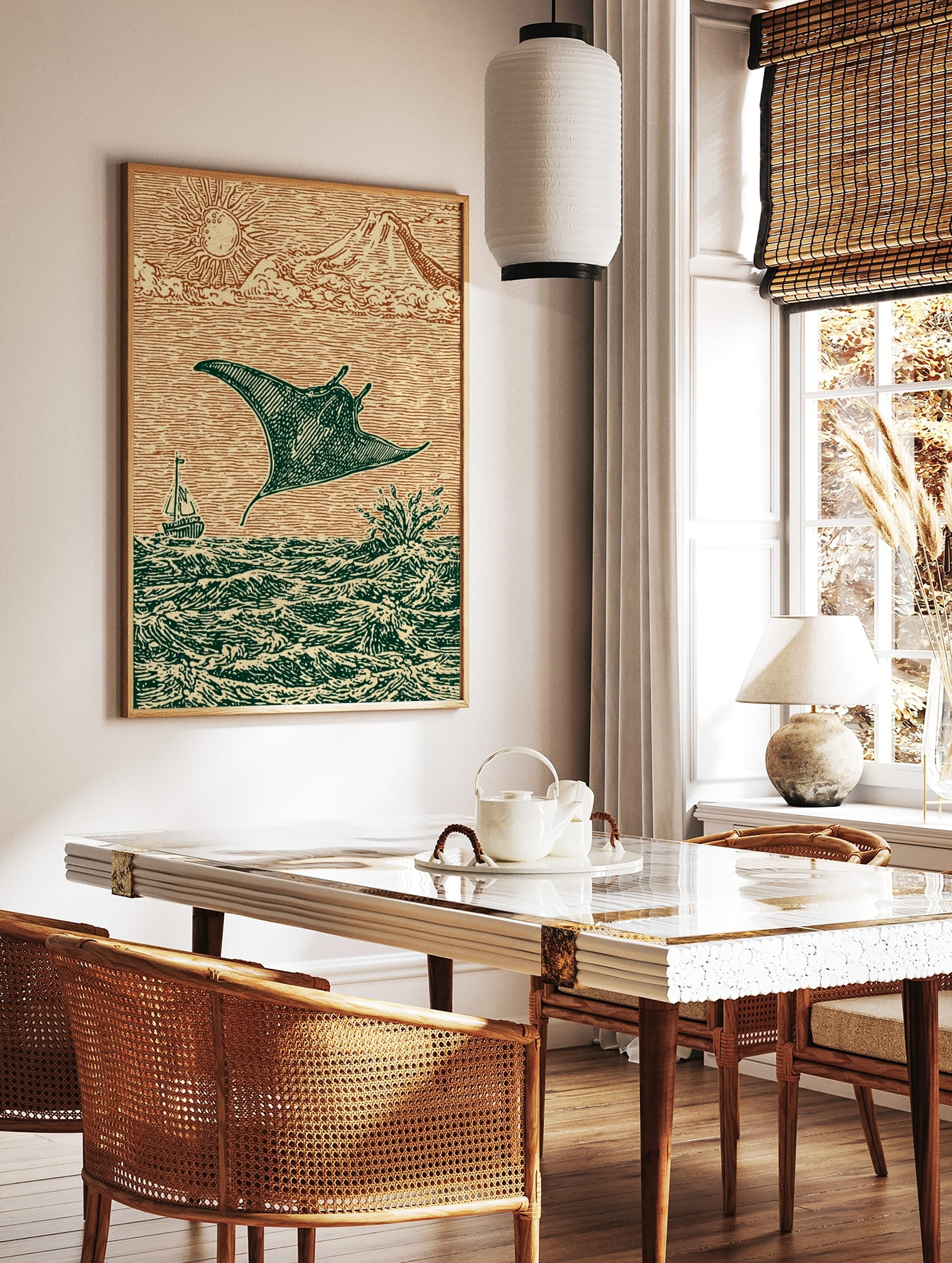 Woodcut style print of a manta ray leaping from ocean waves with a sailboat, sun, and mountains, in a styled room mockup