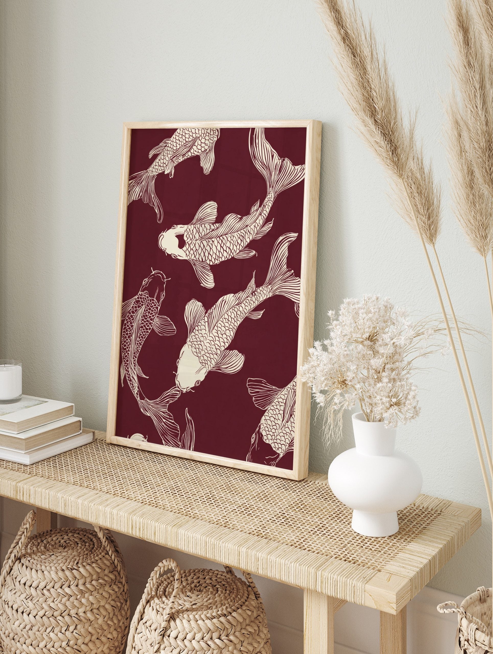 Several off-white Koi fish illustrations swimming on a deep maroon background, in a Japanese, in an alternate framed mockup