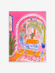 Vibrant illustrative print of a Moroccan archway interior with pink walls, palm tree, and blue patterned rugs