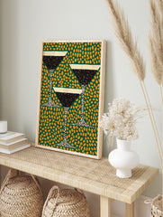 Illustrative martini cocktail glasses with black liquid and white rim on a green background, in an alternate framed mockup