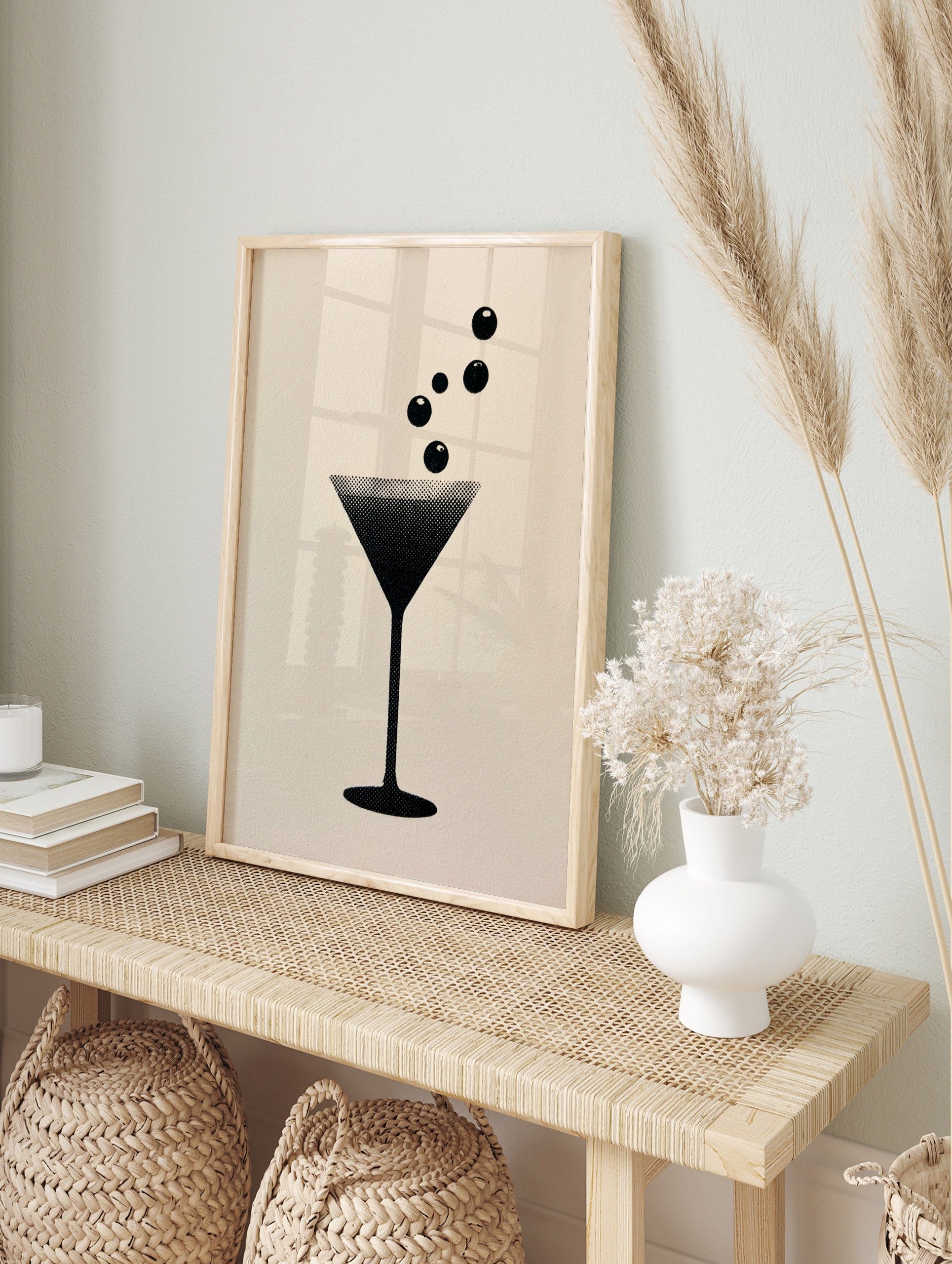 Minimalist martini glass graphic art print with halftone dot texture on a neutral background, in an alternate framed mockup