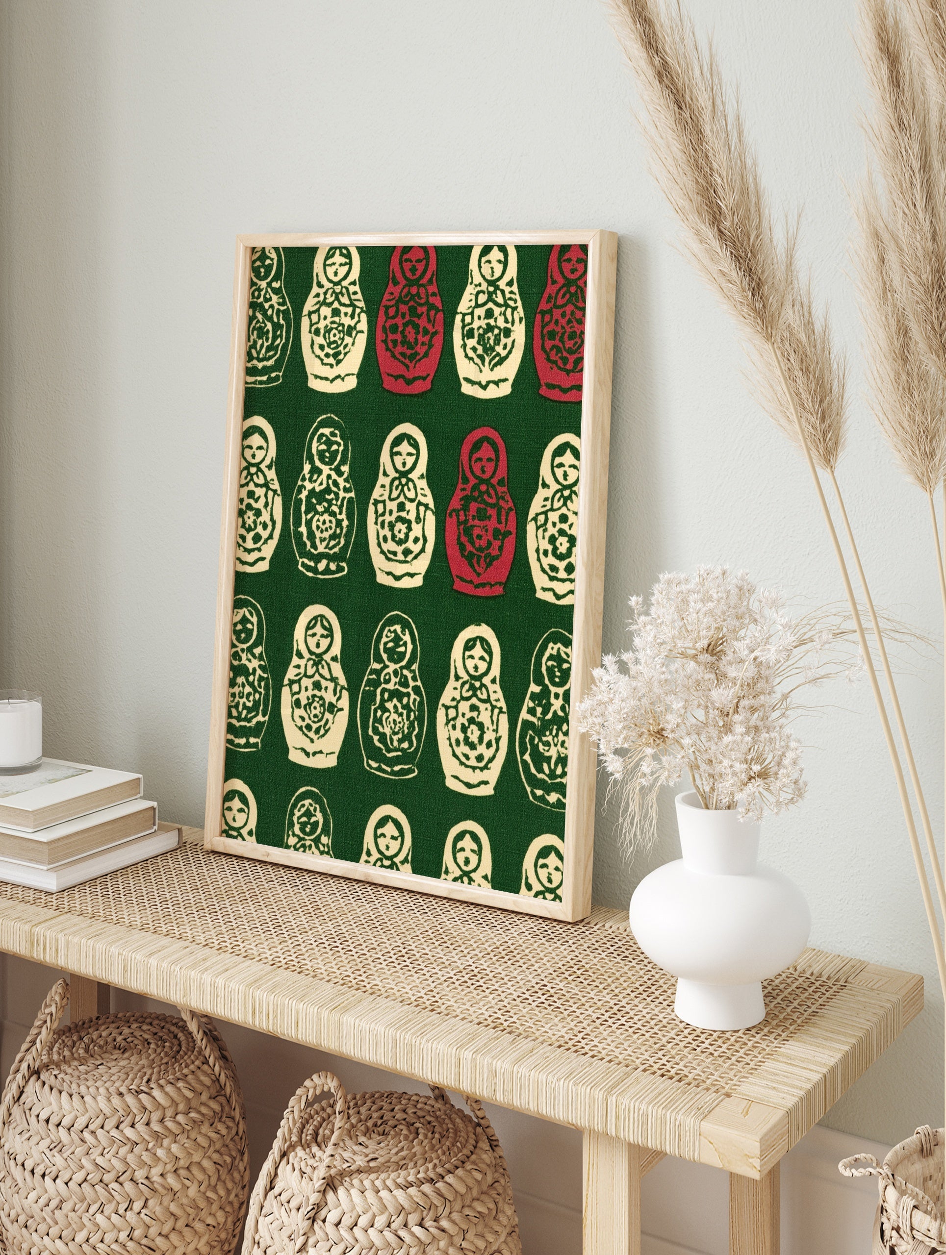 Repeating pattern of cream and red Russian Matryoshka nesting dolls with floral designs on a, in an alternate framed mockup