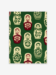 Repeating pattern of Matryoshka nesting dolls in red, cream, and green on a dark green background wall art print