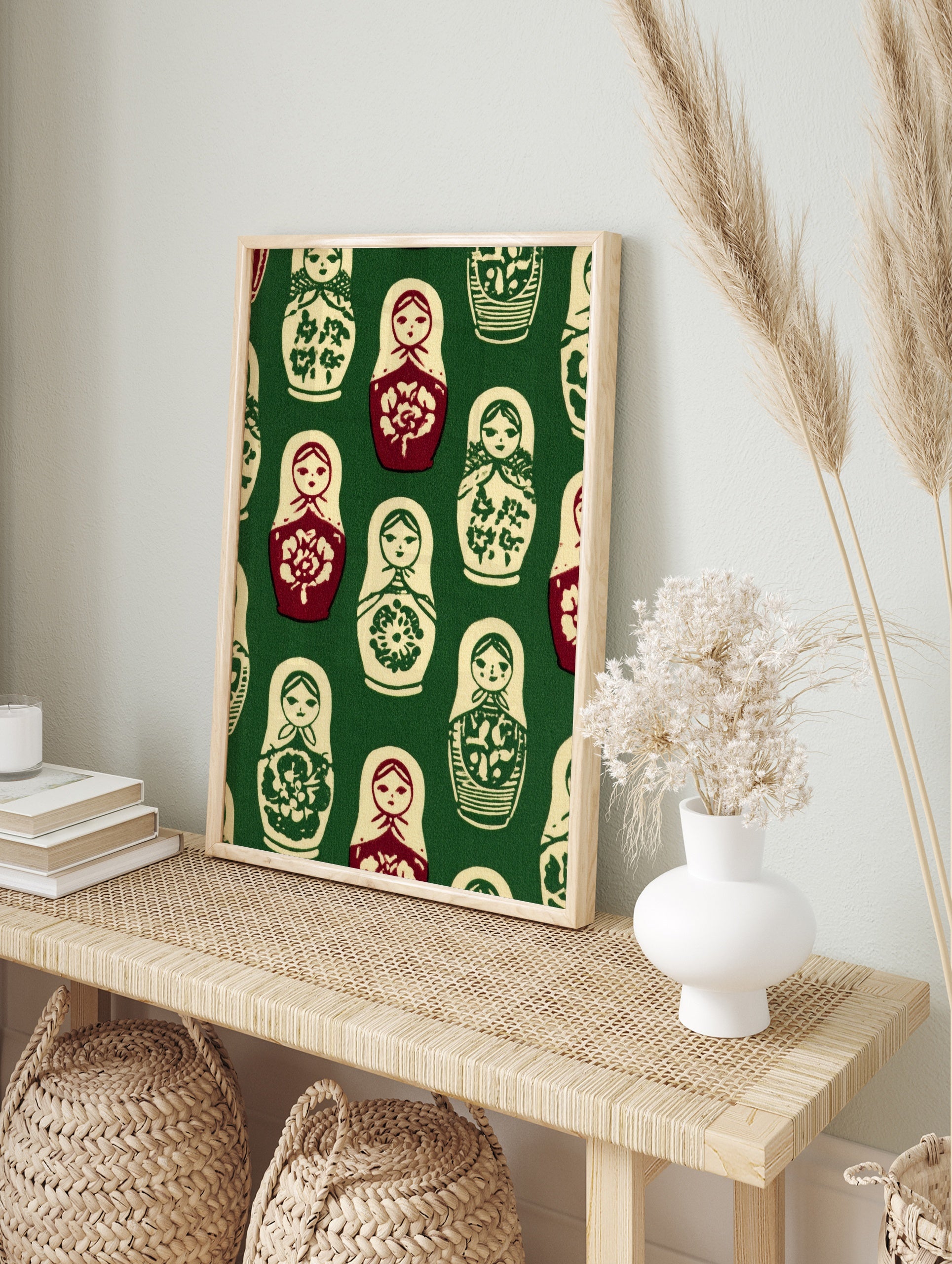 Repeating pattern of Matryoshka nesting dolls in red, cream, and green on a dark green, in an alternate framed mockup