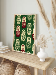 Repeating pattern of Matryoshka nesting dolls in red, cream, and green on a dark green, in an alternate framed mockup