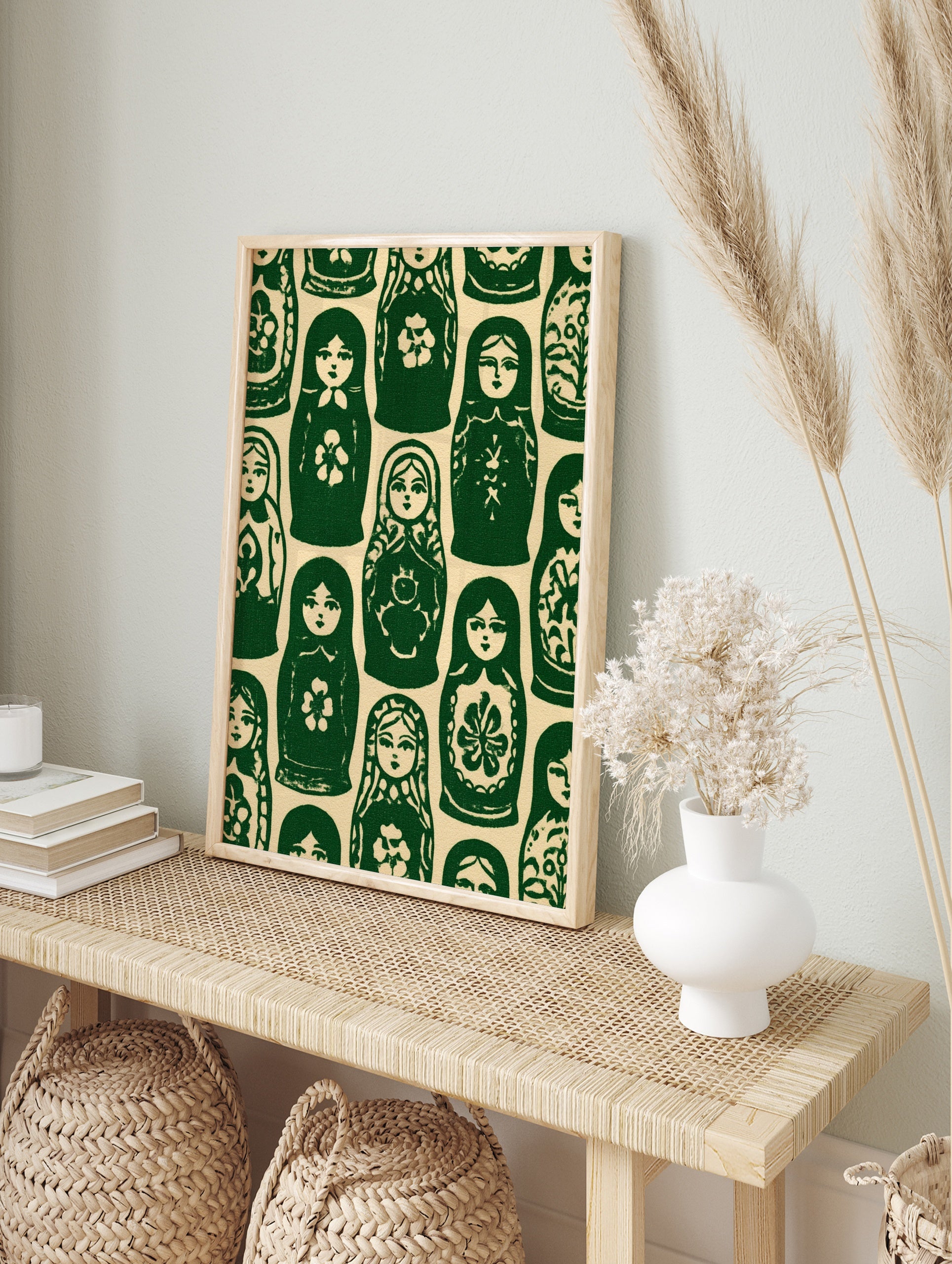 Repeating pattern of green and cream Matryoshka nesting dolls in a folk art illustrative style, in an alternate framed mockup