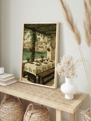 Painting of an outdoor dining table under a green pergola overlooking a Mediterranean coastal town and turquoise water. - Image 3