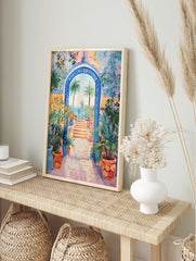 Vibrant Mediterranean Gateway Poster featuring a blue arched entrance, palm trees, ocean view, and colorful potted plants. - Image 4