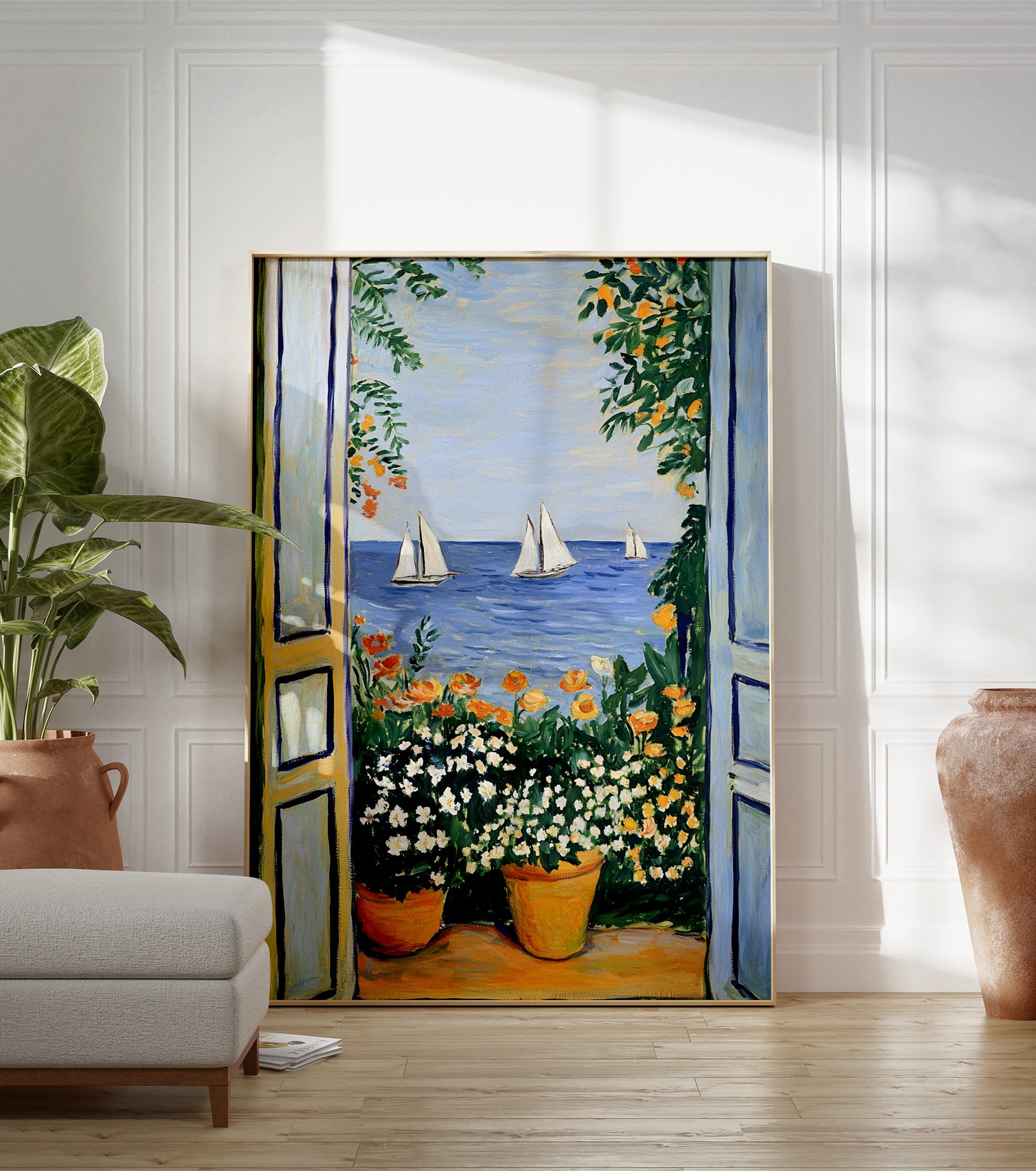 Vibrant Mediterranean sea view poster with open blue doors, potted white and orange flowers, and sailboats on blue water. - Image 3