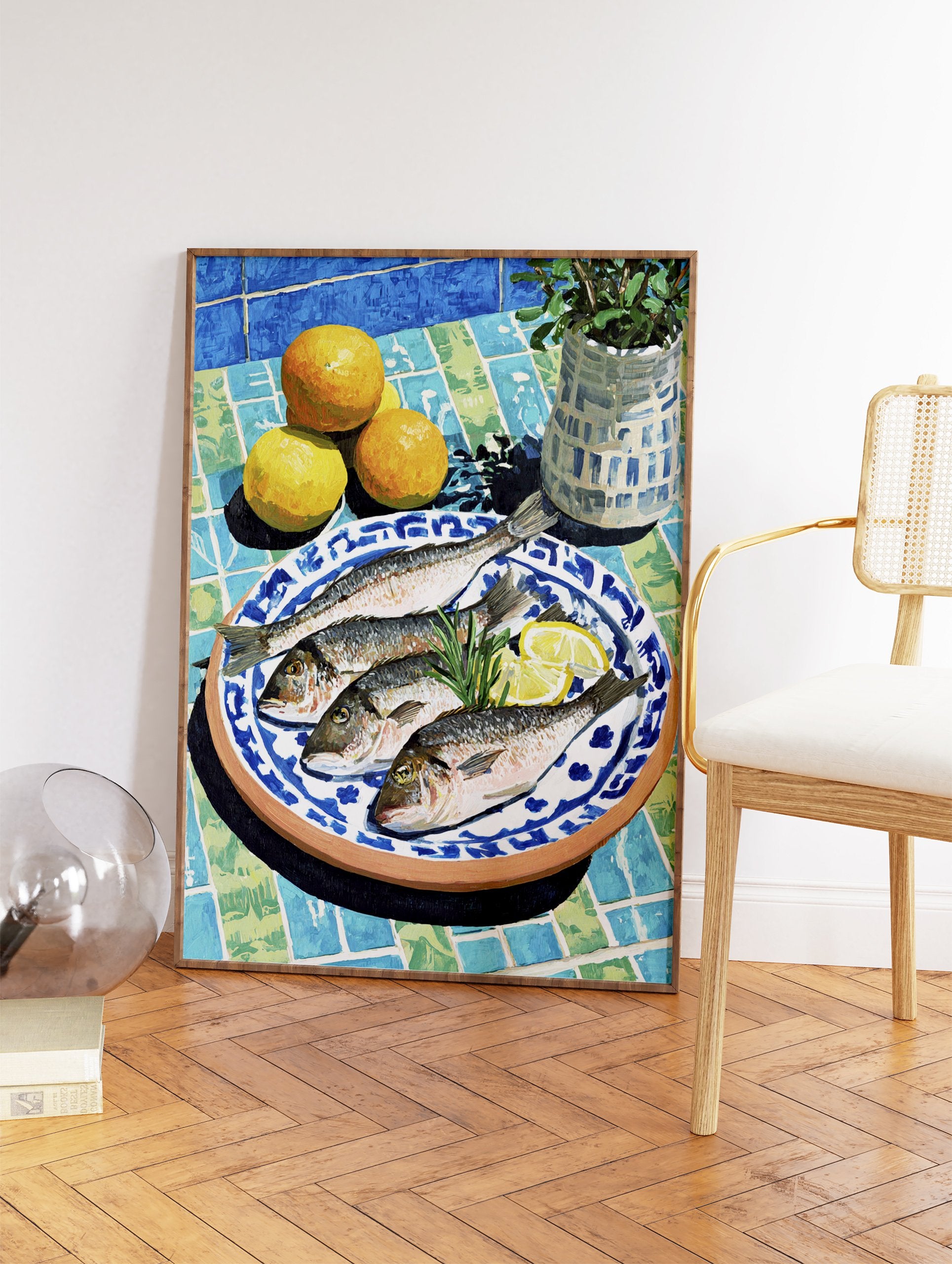 Mediterranean still life painting with four fish, lemon slices, oranges, and rosemary on a blue and green tiled table with a plant. - Image 2