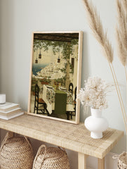 Mediterranean coastal village painting with white buildings, blue sea, and an inviting dining patio scene. - Image 3