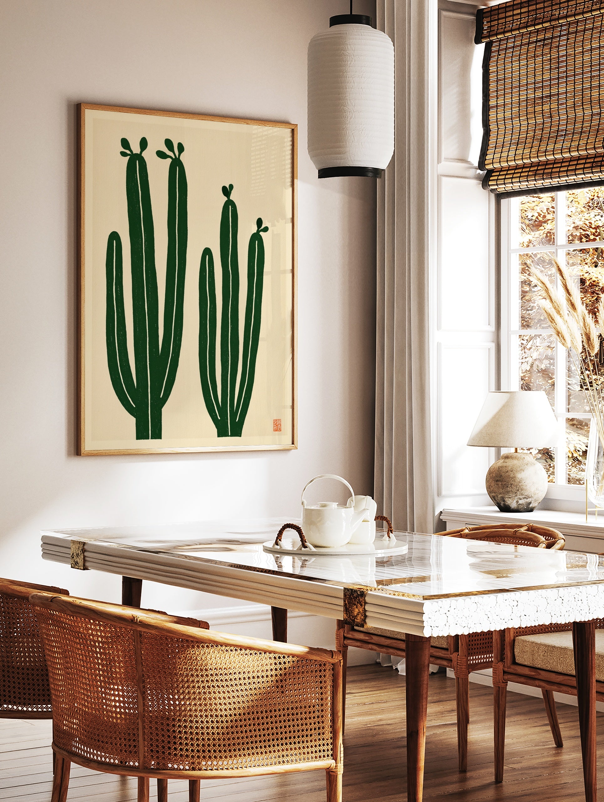 Minimalist cactus wall art with two green cacti on a cream background, illustrative botanical print, in a styled room mockup