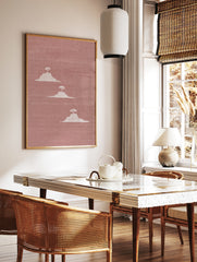 Minimalist landscape wall art featuring three white mesa hills with trees on a textured dusty pink, in a styled room mockup