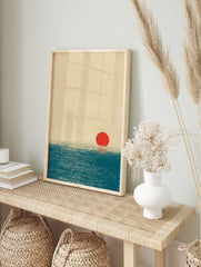 Minimalist ocean wall art print featuring a red sun reflecting on a textured blue sea under a beige sky, unframed. - Image 3