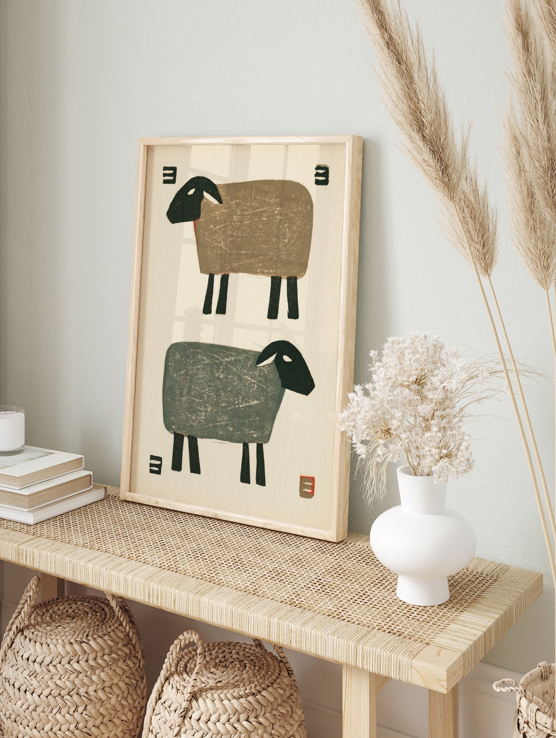 Minimalist sheep illustration with two stylized sheep in brown and grey against an off-white, in an alternate framed mockup