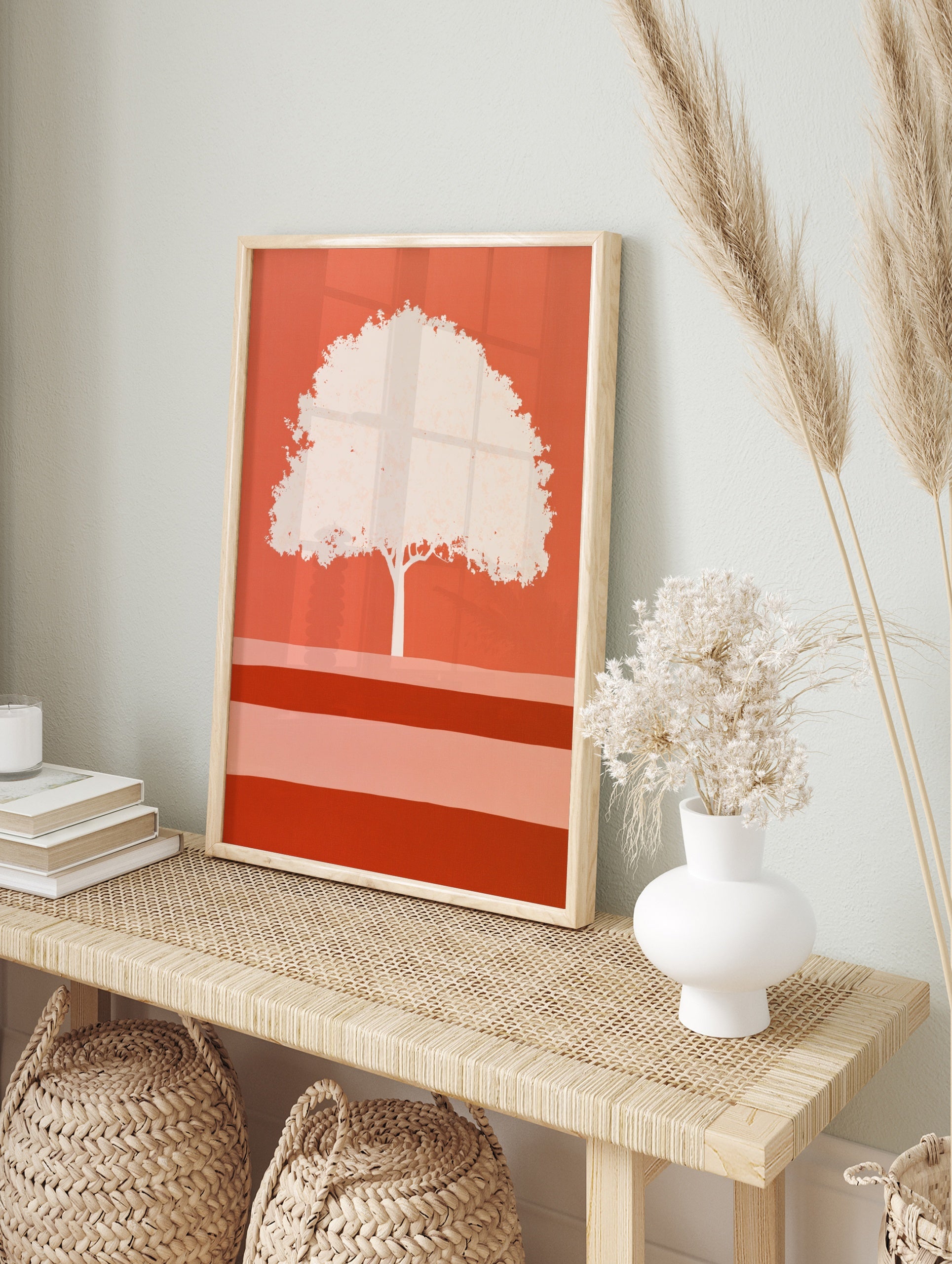 Minimalist tree illustration with a pale canopy on a vibrant orange background, graphic, in an alternate framed mockup