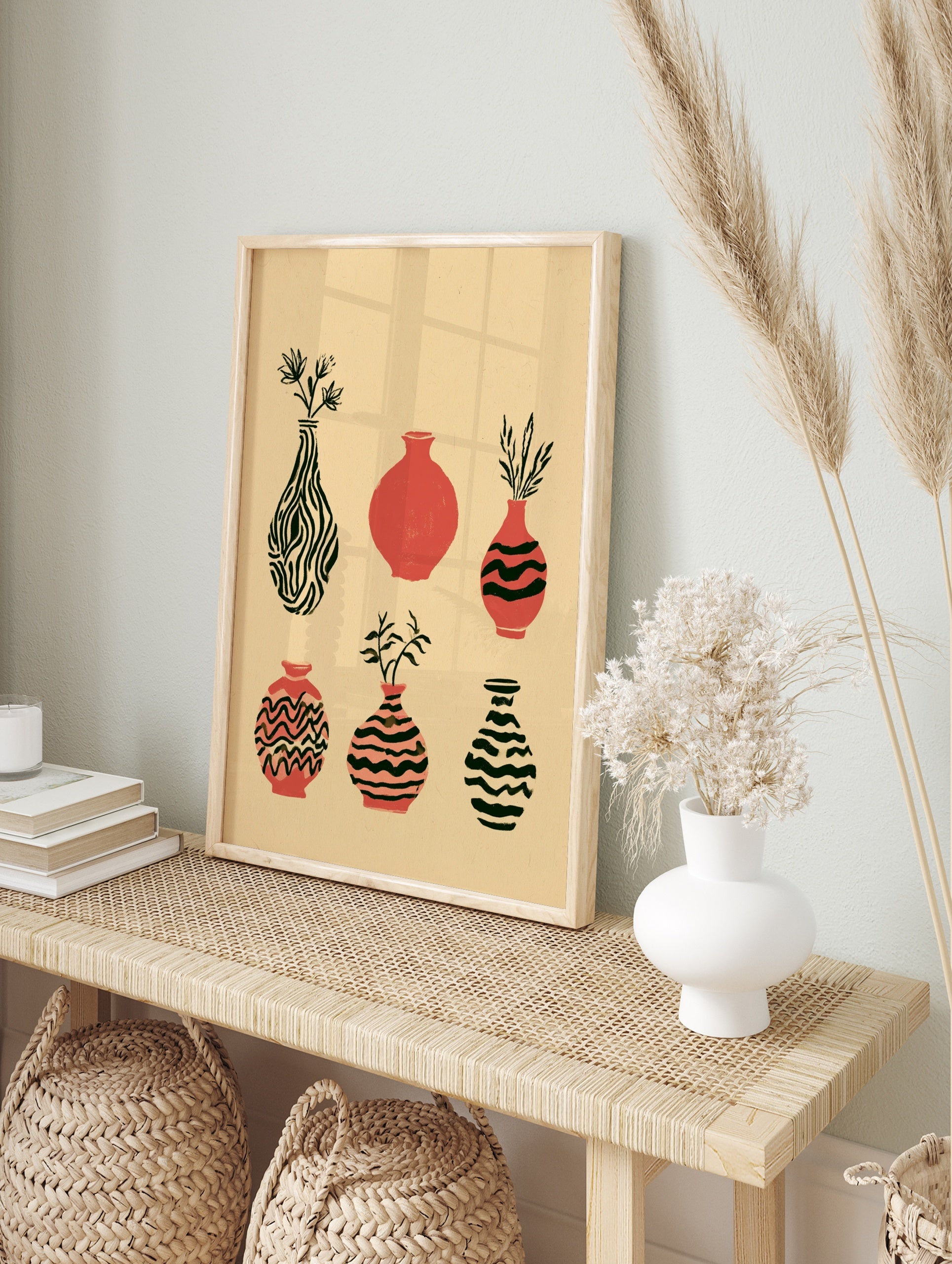 Six illustrative vases with botanical accents and striped patterns in terracotta and black on, in an alternate framed mockup