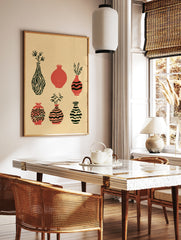 Six illustrative vases with botanical accents and striped patterns in terracotta and black on a, in a styled room mockup