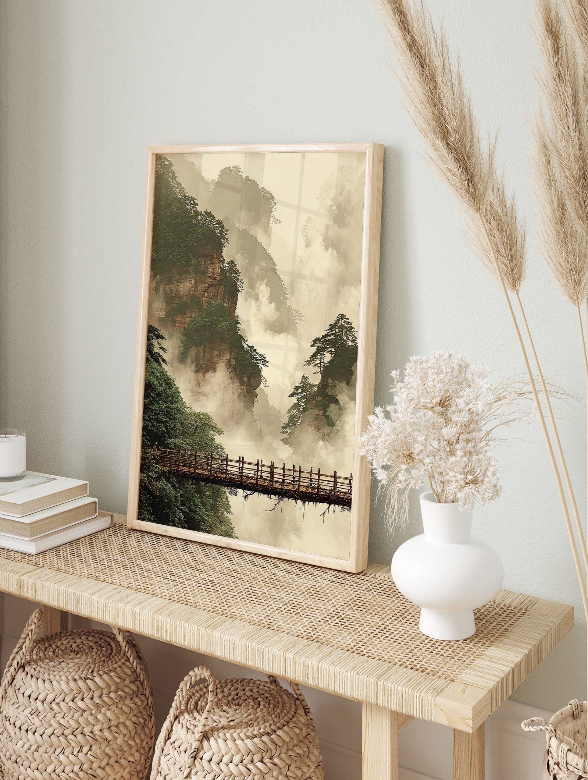 Misty mountain landscape art print with towering cliffs, green pine trees, and a wooden, in an alternate framed mockup