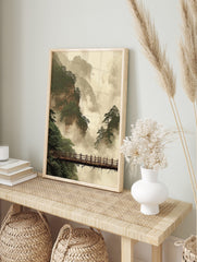 Misty mountain landscape art print with towering cliffs, green pine trees, and a wooden, in an alternate framed mockup