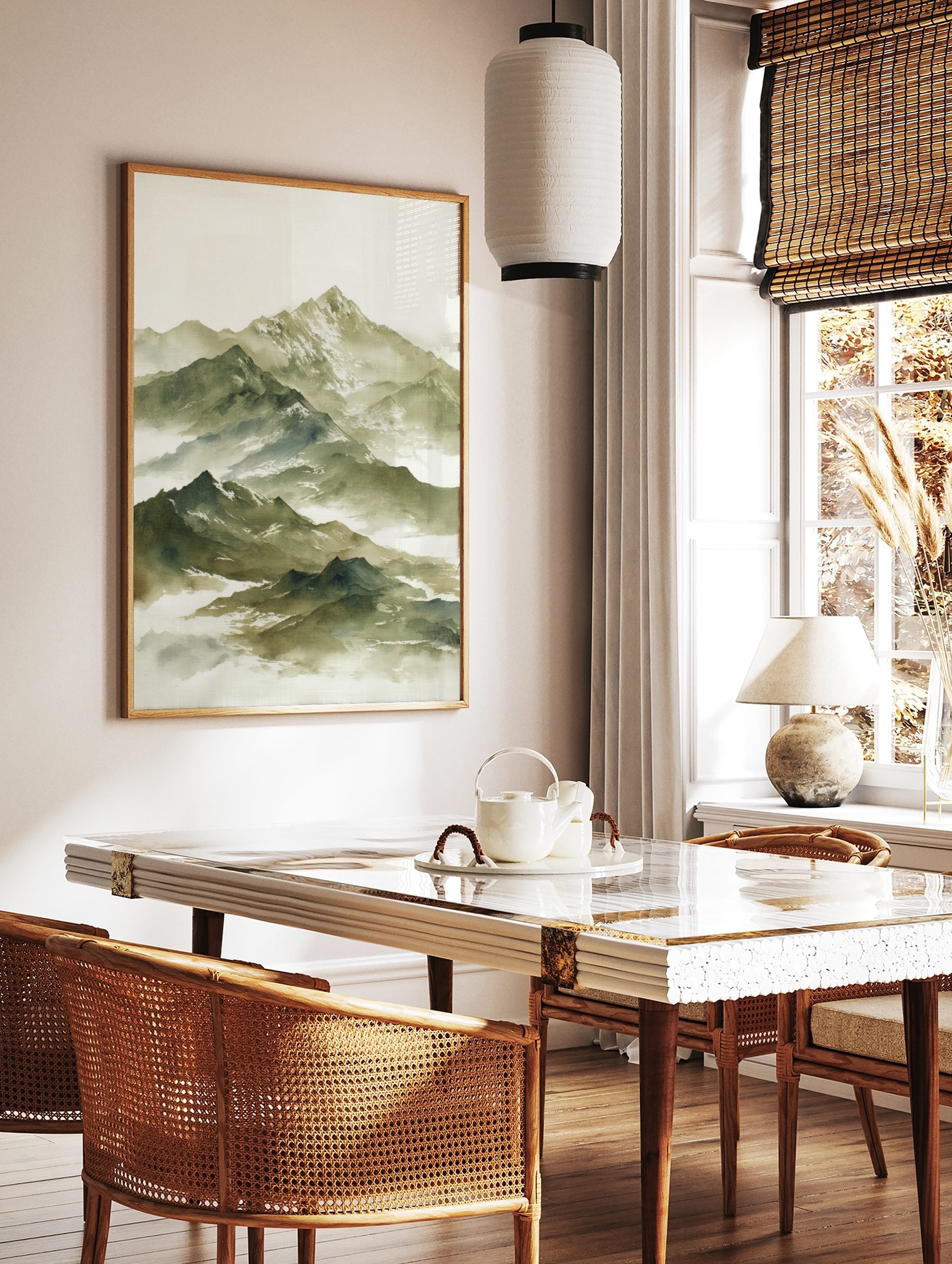 Watercolour painting of a layered misty mountain range with snow-capped peaks in green and white, in a styled room mockup