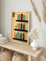 Modern bookshelf art print with geometric books in teal, coral, and blue on black shelves against a beige background. - Image 3