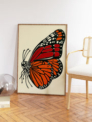 Illustrated Monarch butterfly wall art print featuring orange and red wings with black and white details on a cream background. - Image 2