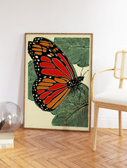 Monarch butterfly woodcut style print with orange, black, and green on a light background with leaves. - Image 2