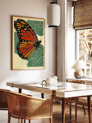 Monarch butterfly woodcut style print with orange, black, and green on a light background with leaves. - Image 3