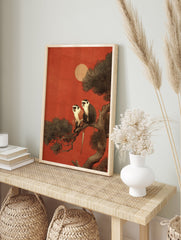 Illustration of two monkeys with white faces and chests sitting on a tree branch against a deep red sky with a pale sun. - Image 3