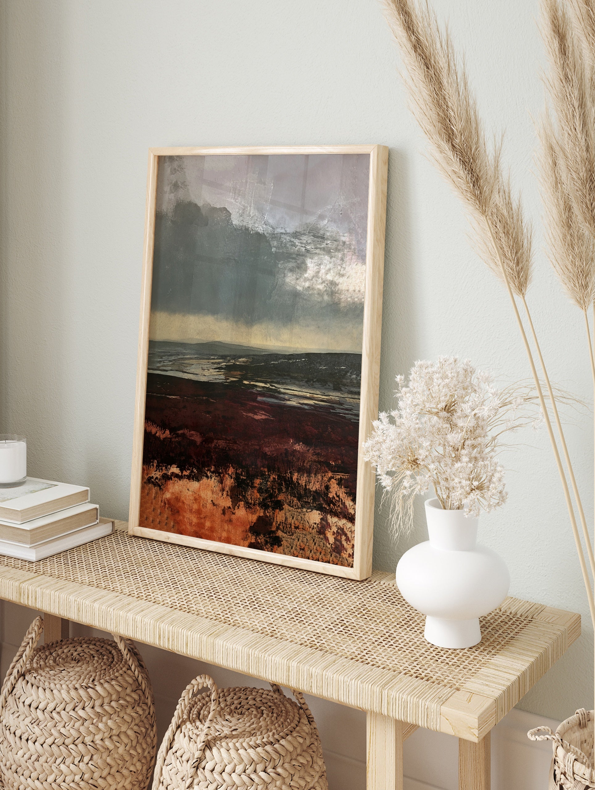 Moody moorland landscape painting with dark sky and deep red heather foreground, atmospheric, in an alternate framed mockup