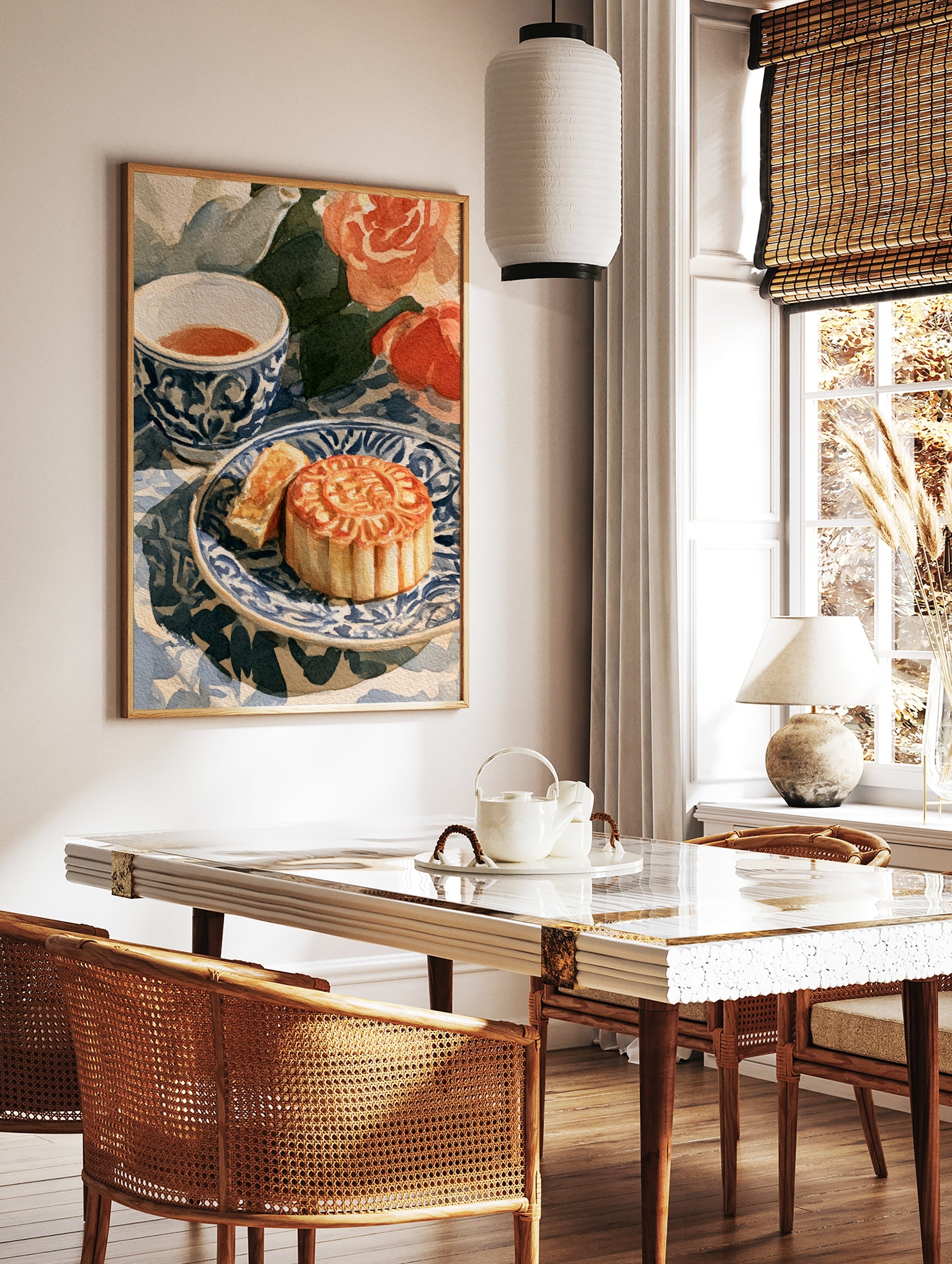 Watercolour illustration of a sliced mooncake on a blue and white patterned plate with a teacup and, in a styled room mockup