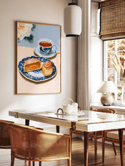 Watercolor illustration of a mooncake and teacup on a blue patterned plate with a white peony, in a styled room mockup