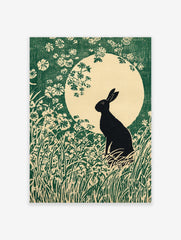 Black rabbit silhouette in a field of green grass and white flowers against a large pale moon in an illustrative art print