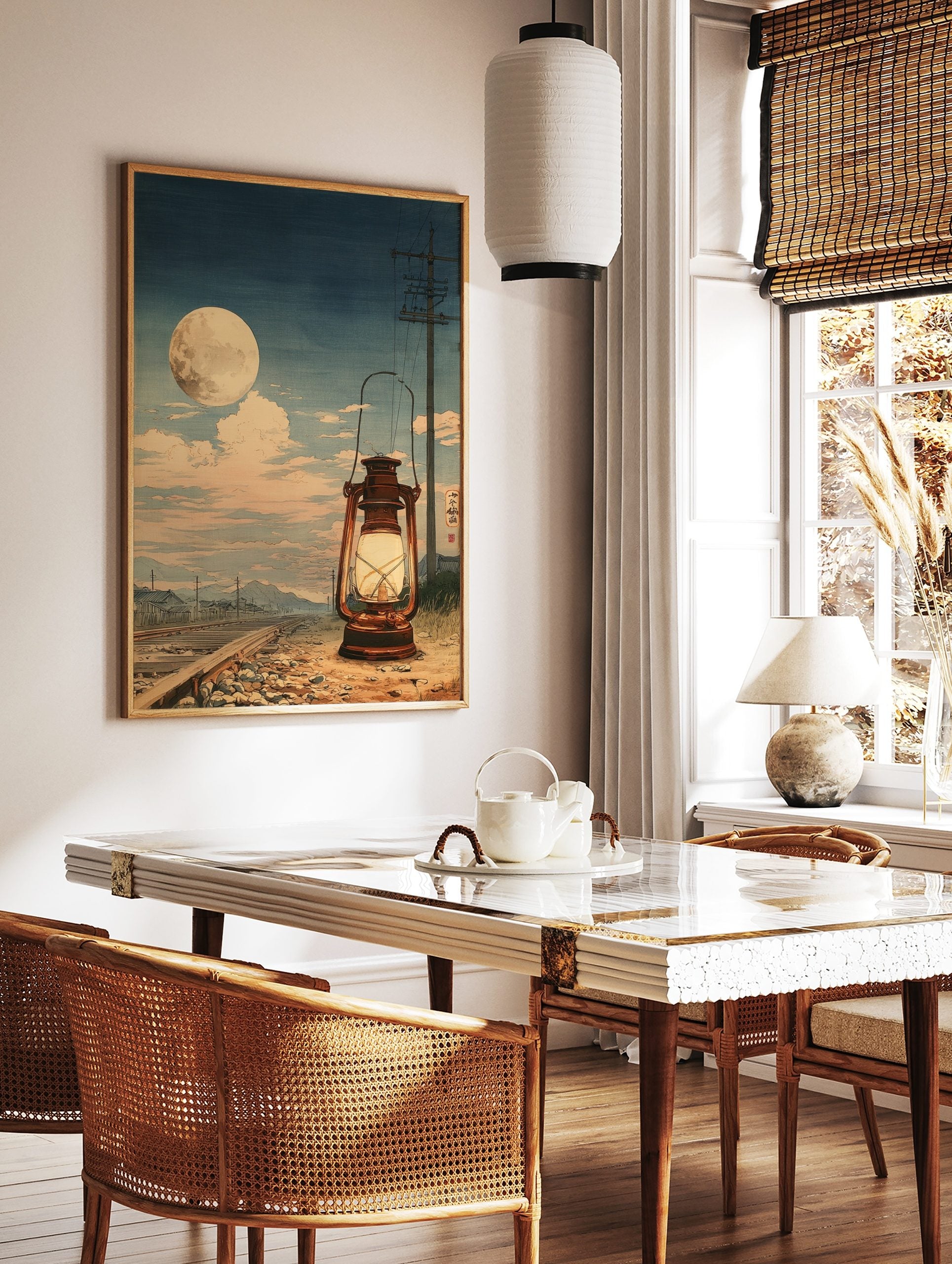 Japanese woodblock style art print of a glowing lantern on railway tracks under a large full moon, in a styled room mockup