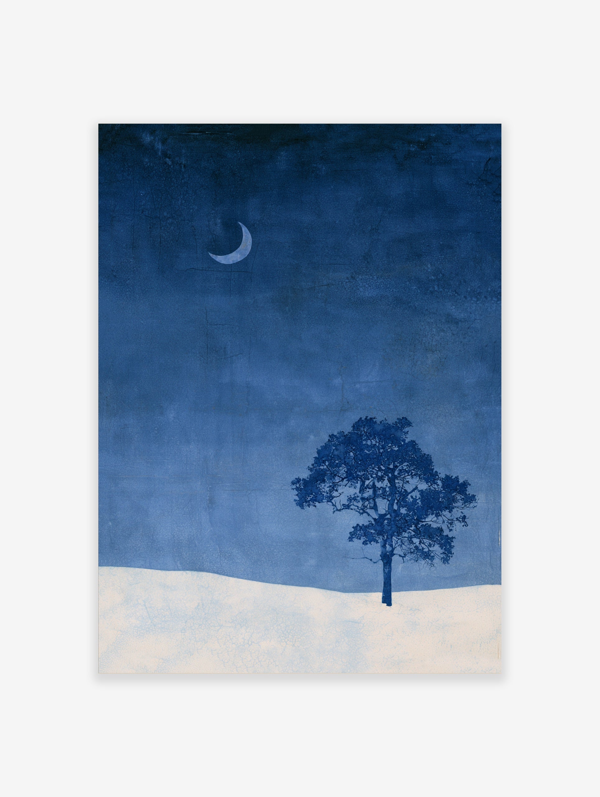Minimalist wall art print of a single tree and crescent moon over a snowy landscape in deep blue and white