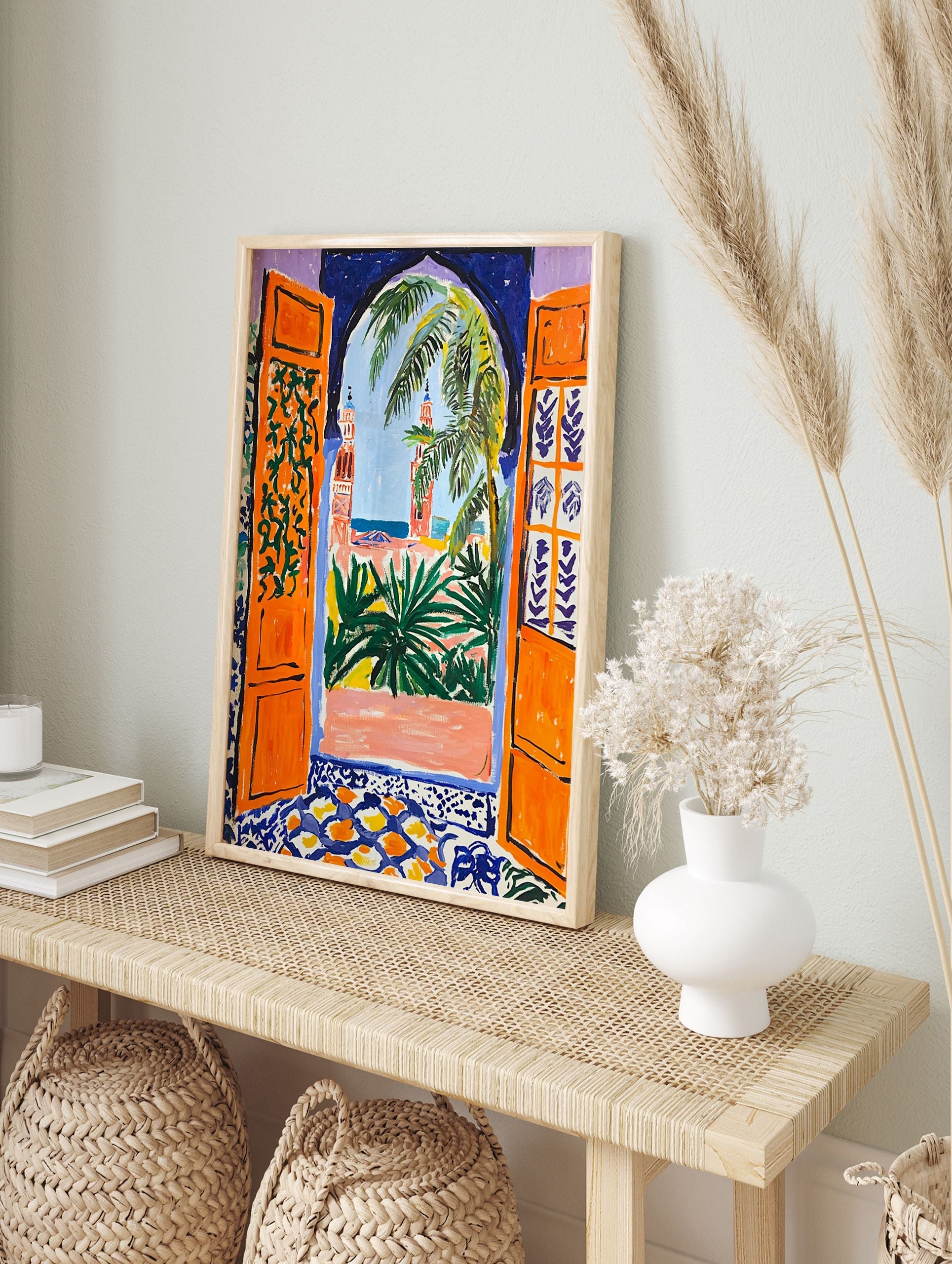 Moroccan Archway Poster depicting an orange archway looking out to minarets, palm trees, and a blue sky. - Image 4