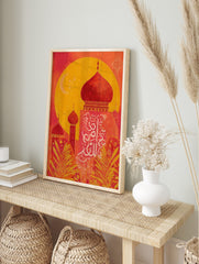 Red and yellow mosque domes with white Arabic calligraphy and crescent moon against a large, in an alternate framed mockup
