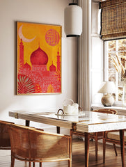 Red mosque with domes and minarets against an orange sky, with a crescent moon and Arabic, in a styled room mockup