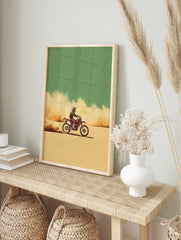 Illustrative motocross dirt bike rider on a red bike, kicking up dust in a beige desert under, in an alternate framed mockup